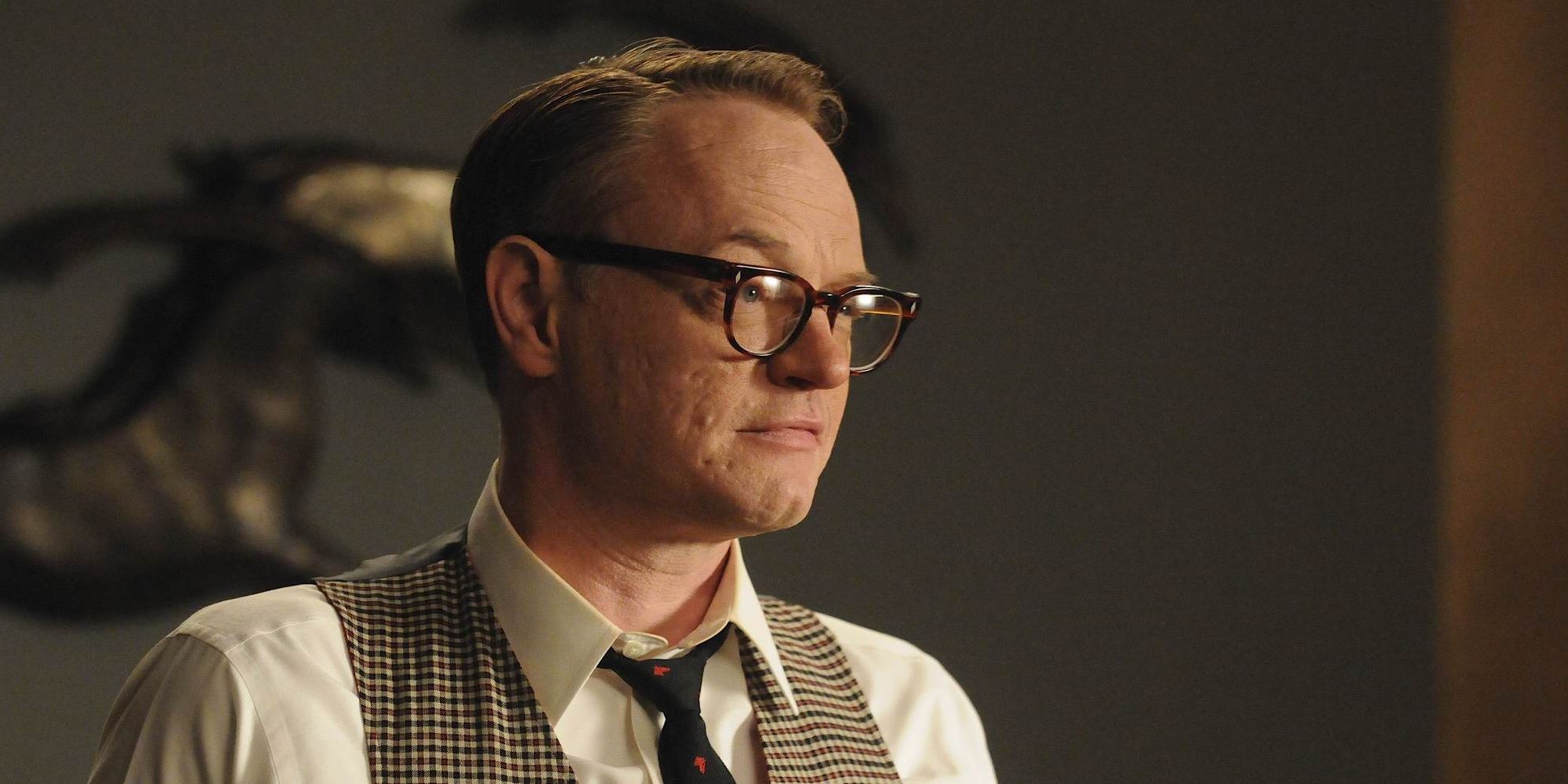 Lane Pryce in glasses and period outfit on Mad Men