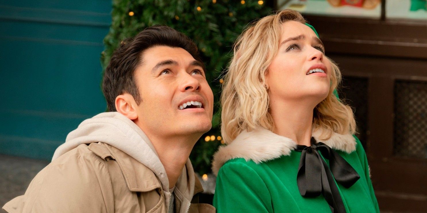 Henry Golding and Emilia Clarke looking up in Last Christmas