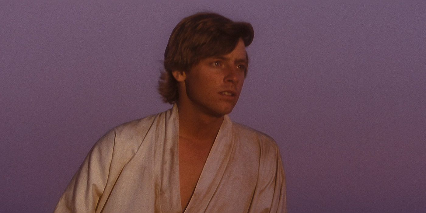 Luke Skywalker looks out towards the twin suns of on Tatooine in Star Wars A New Hope
