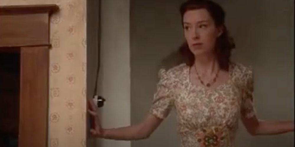 Molly Parker standing in a doorway in War Bride