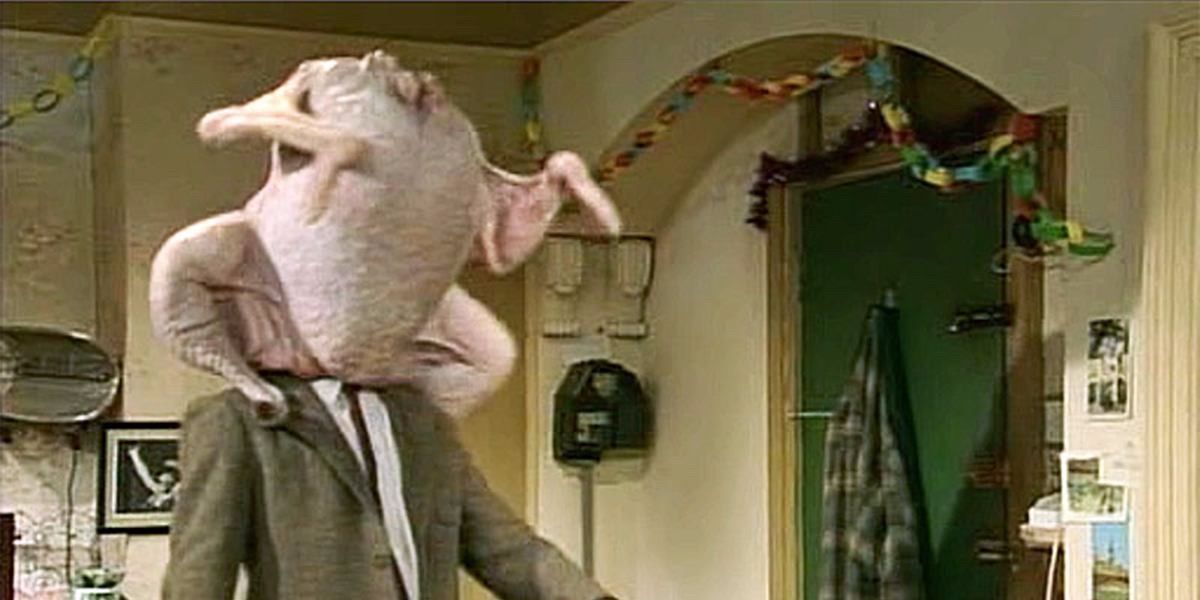 Mr. Bean with his head stuck in the Christmas Turkey