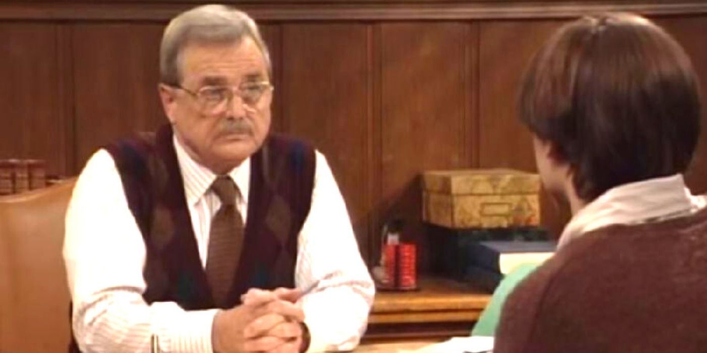 Mr. Feeny at his desk talking to Eric on Boy Meets World