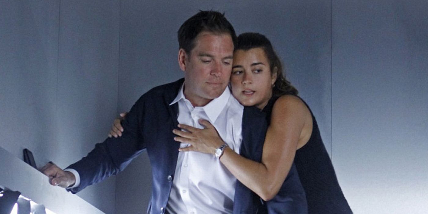 Ziva holds Tony, clutching his arm and chest, inside a dimly-lit shaft