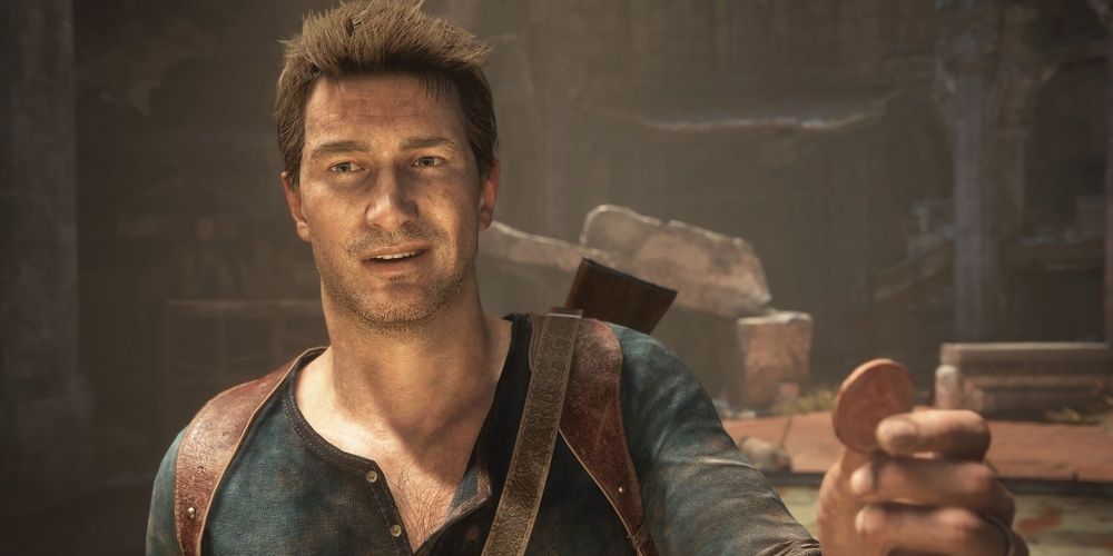 Nathan Drake holds a coin in Uncharted 4