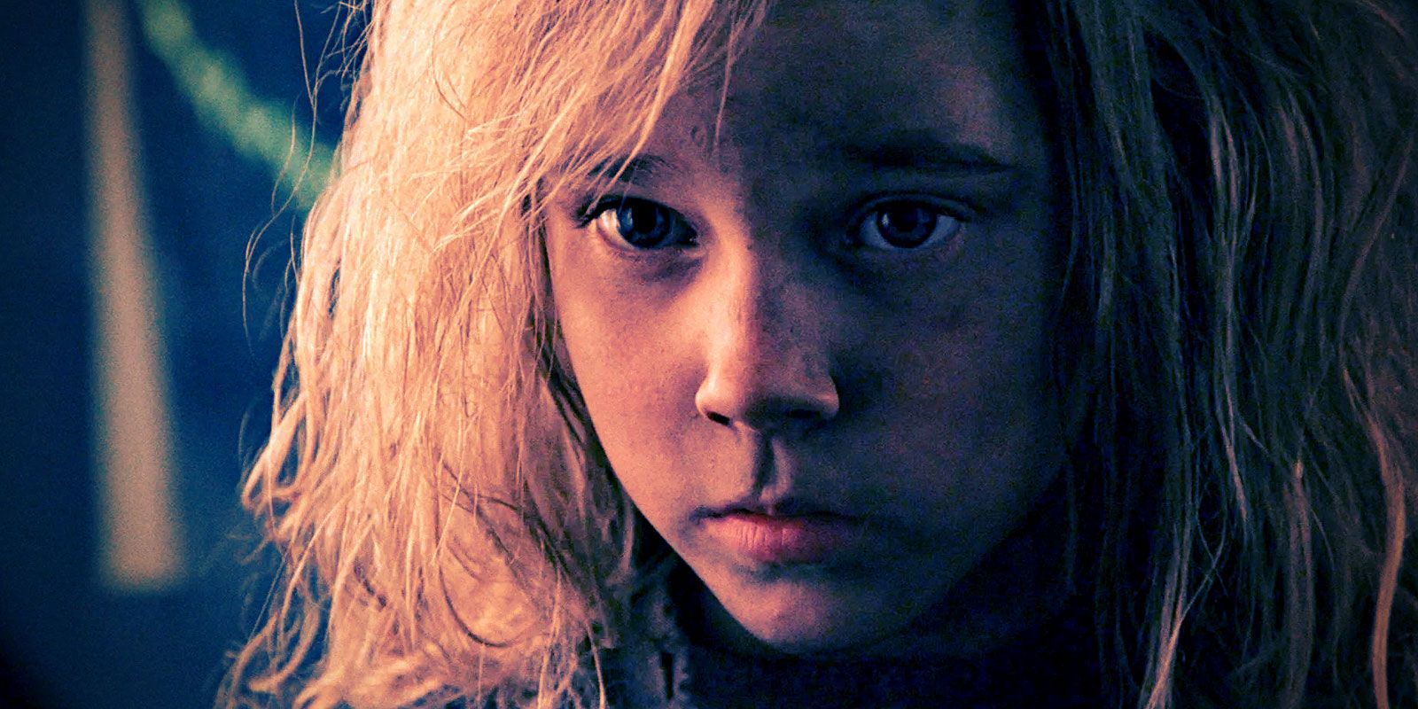 A closeup of Newt's face with her haunted eyes, from Aliens