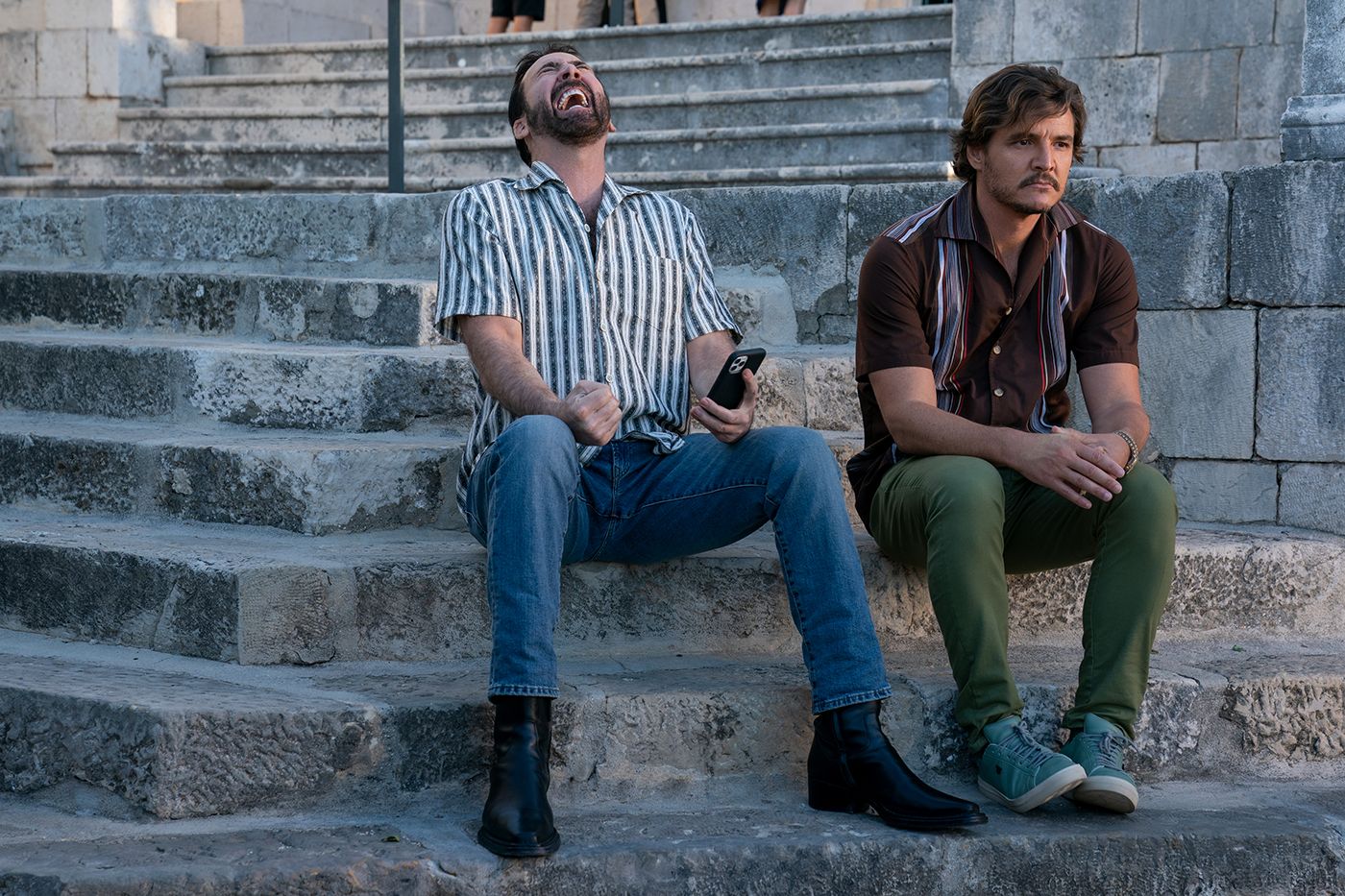 Nicolas Cage as Nic Cage and Pedro Pascal as Javi in The Unbearable Weight of Massive Talent.