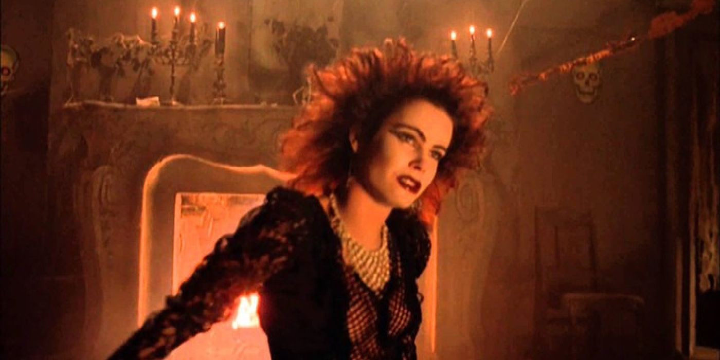 A lady in a eerie room in Night of the Demons