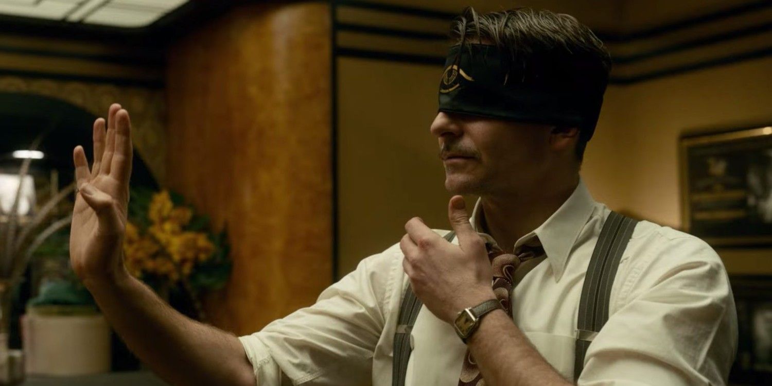 Bradley Cooper with a blindfold on in Nightmare Alley