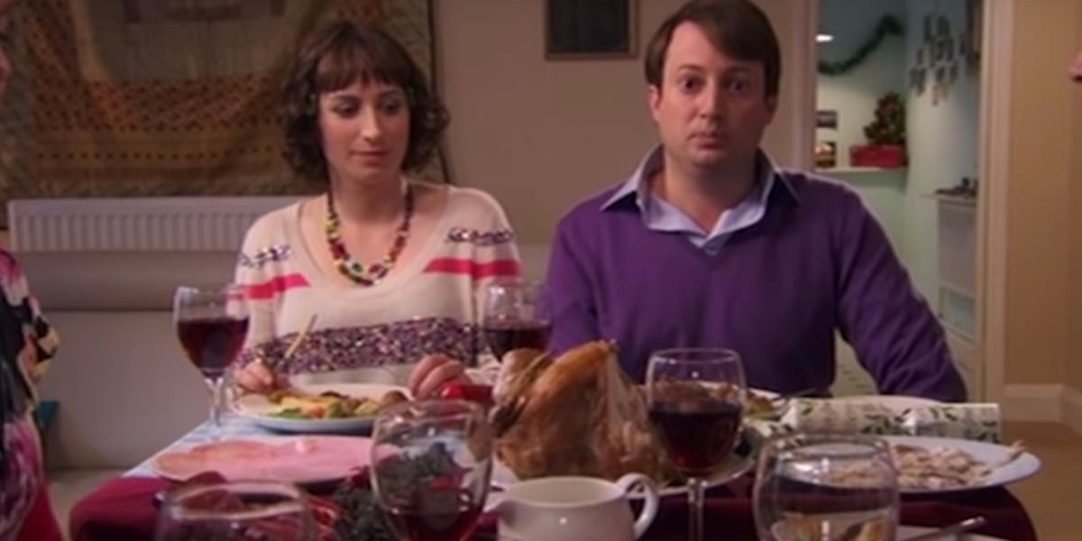 Mark sits with Dobby at Christmas dinner from Peep Show