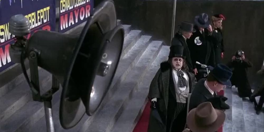 Penguin listens to his own voice recording in Batman Returns