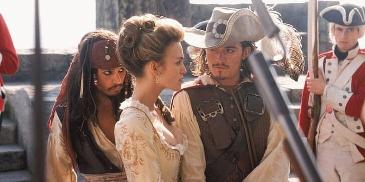 Elizabeth and Will facing a group of soldiers in Pirates-of-the-Caribbean 1