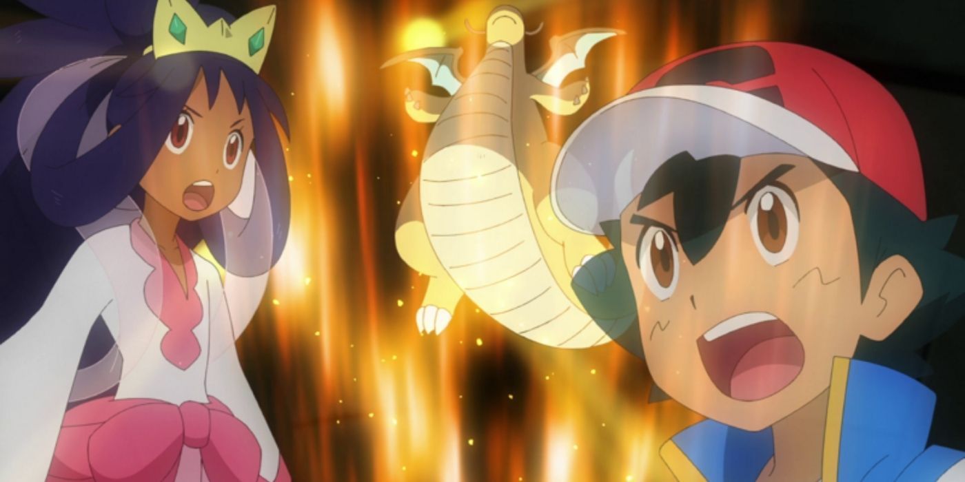 Iris and Ash look surprised while Dragonite shows off his power in the Pokémon anime