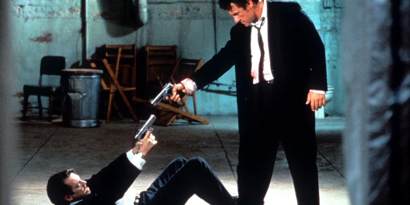 Two men holding each other at gunpoint in Reservoir Dogs 