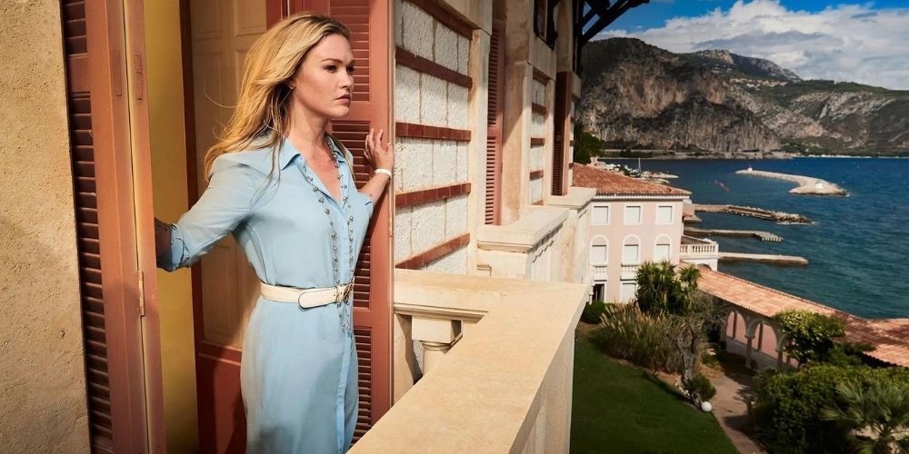 Julia Stiles walks out to her balcony in the French Riviera