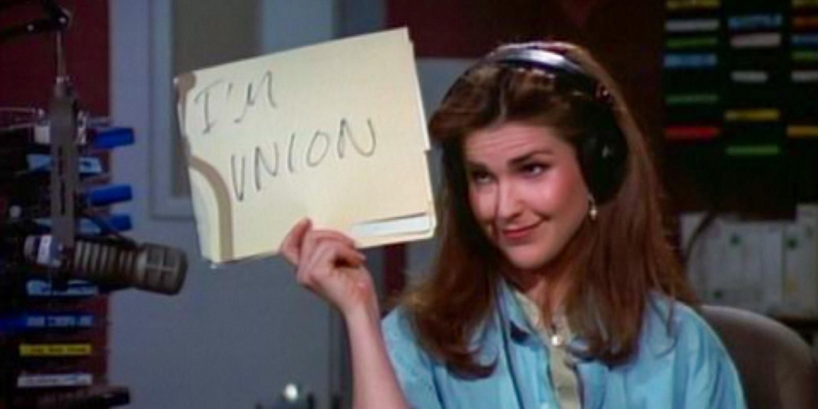 Roz Doyle holds up a sign saying, "I'm union," in Frasier