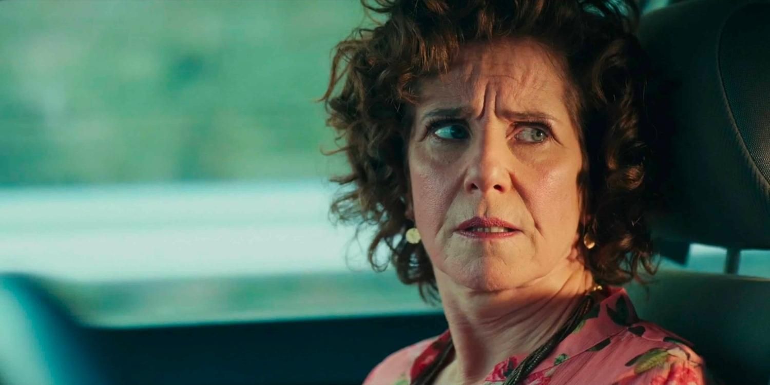 Ruth looking at someone driving in Mr Corman