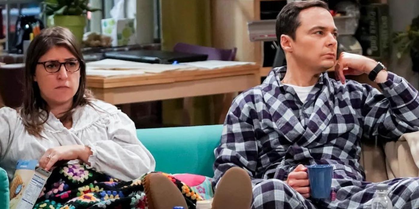 Sheldon and Amy sitting on the couch sulking on TBBT