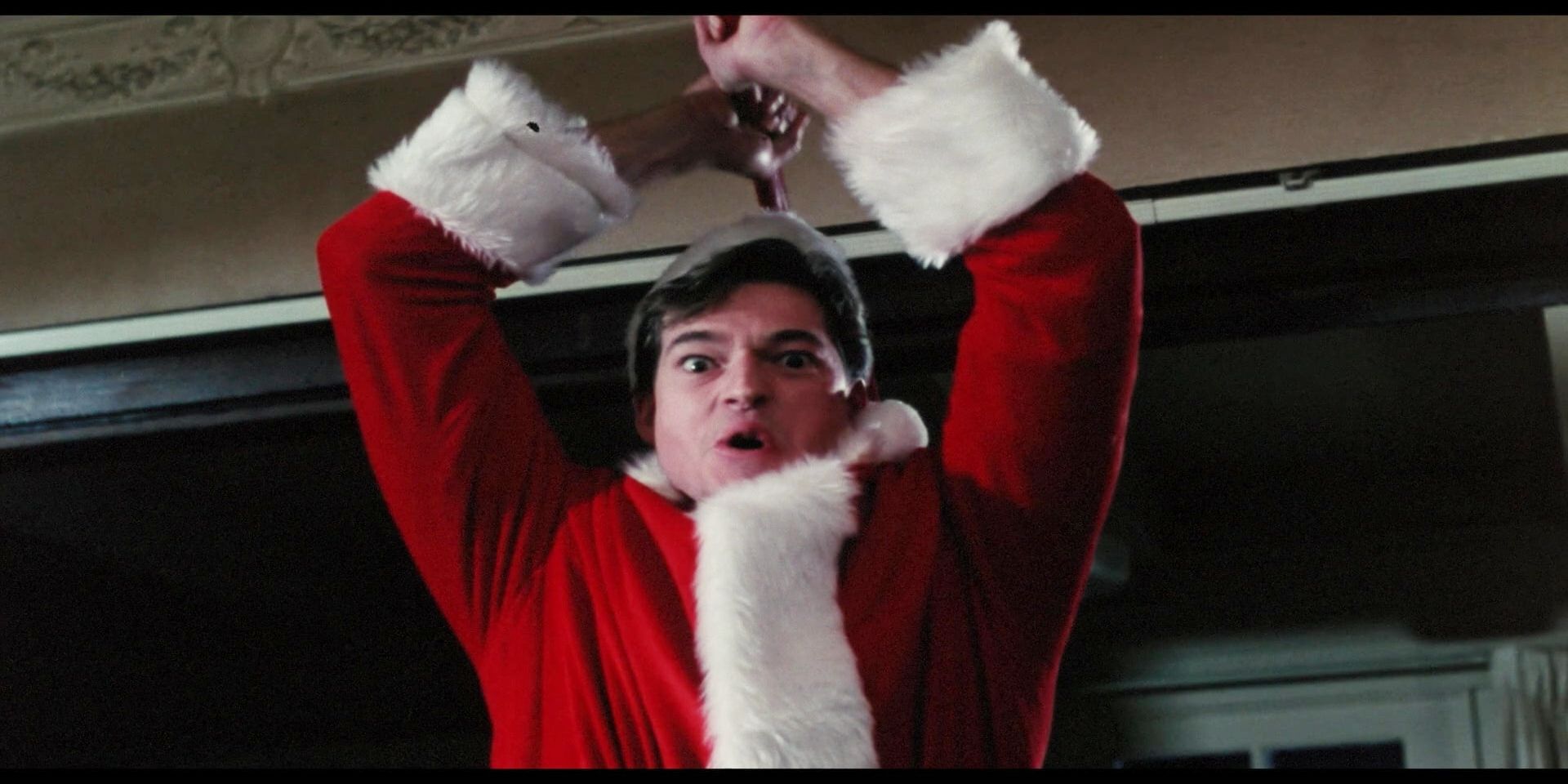 Ricky wielding an ax in the movie Silent Night, Deadly Night Part 2.