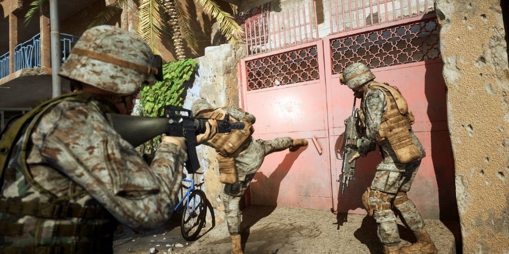US soldiers attempt to break down a door in Six Days in Fallujah