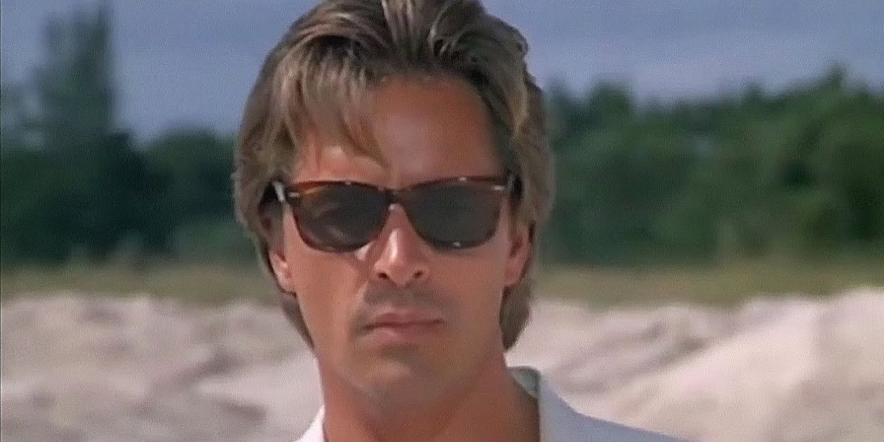 Sonny Crockett looks at the camera with sunglasses on in Miami Vice.