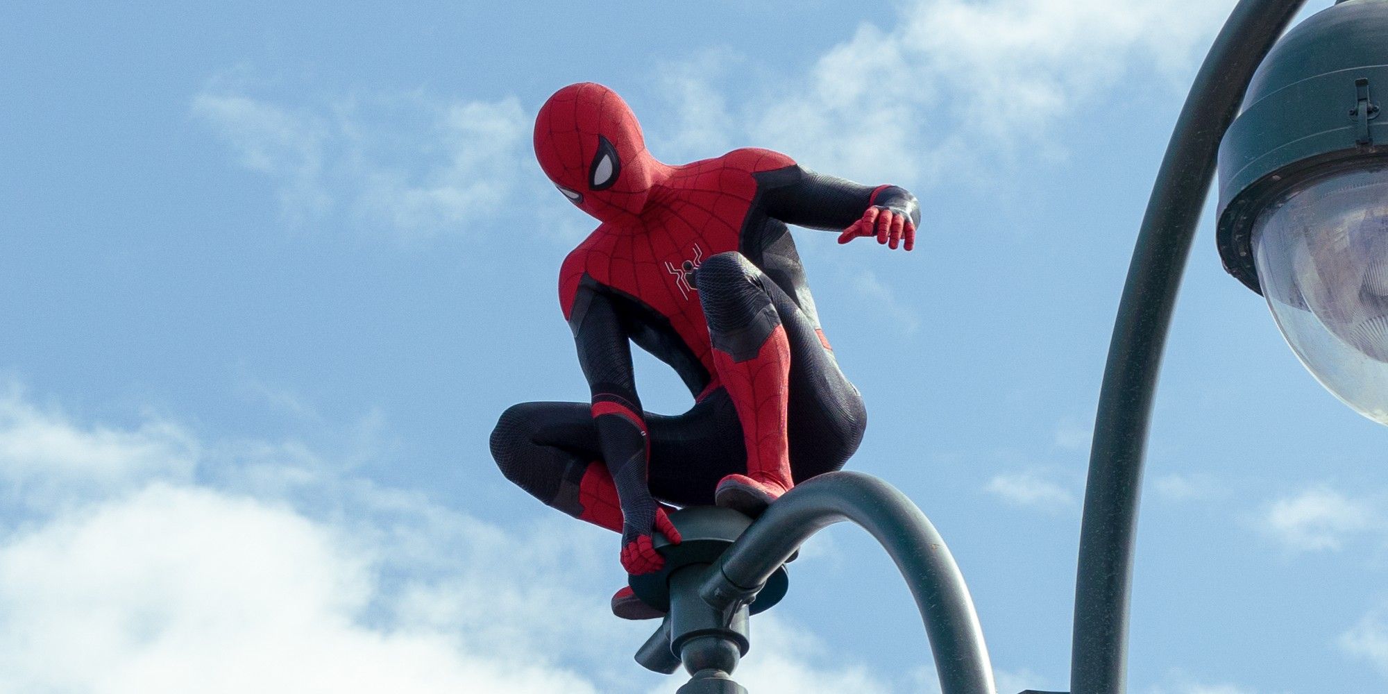 Spider-Man on a lamppost in No Way Home 