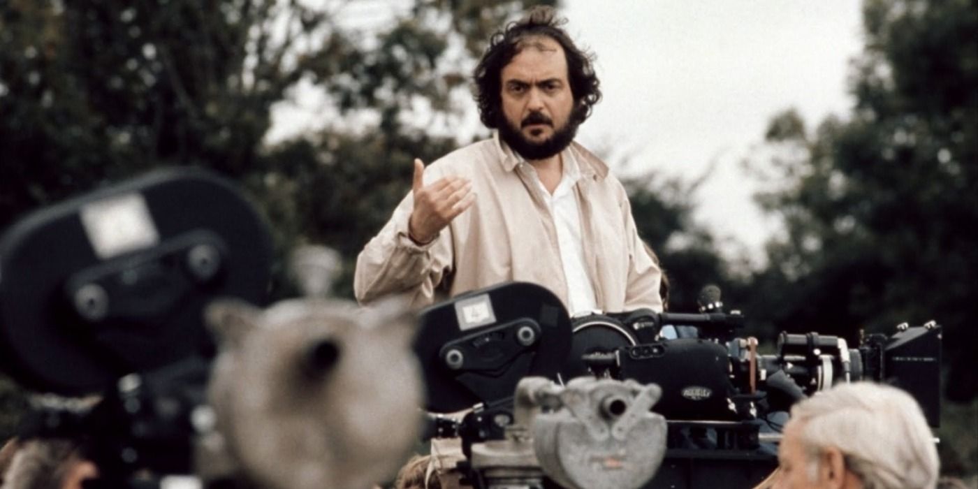Stanley Kubrick stands over film cameras in Stanley Kubrick A Life In Pictures