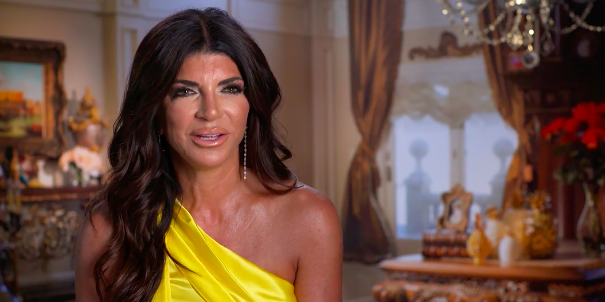 Teresa Giudice RHONJ yellow dress talking to camera