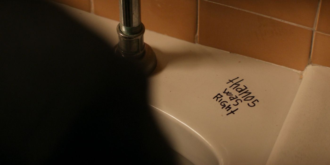 The top of a urinal is vandalized with the words &quot;Thanos is right&quot; in Hawkeye.