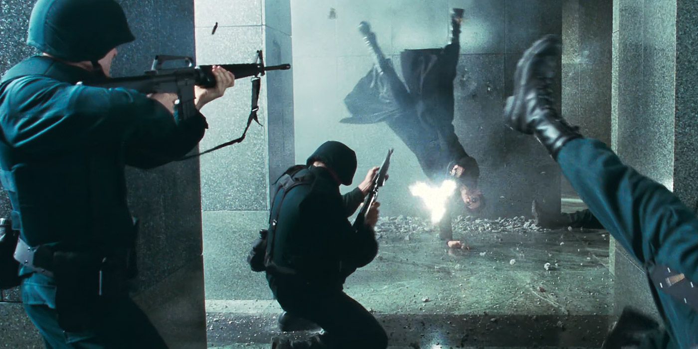 Neo shoots at SWAT personnel in The Matrix
