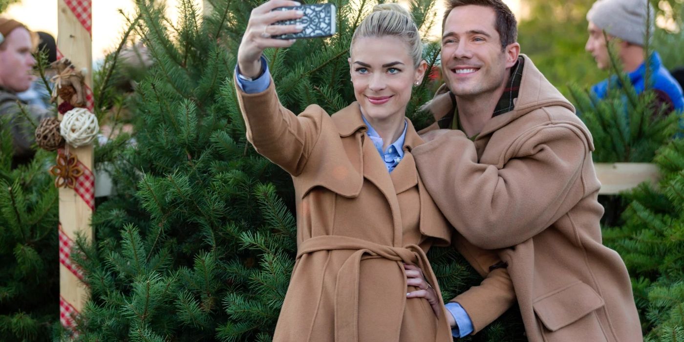 Elise and Nick smiling for a selfie in The Mistletoe Promise