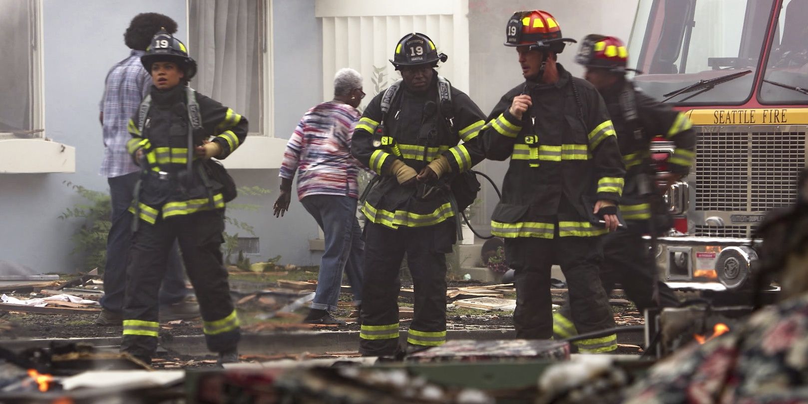 Firefighters go through a rubble in Station 19
