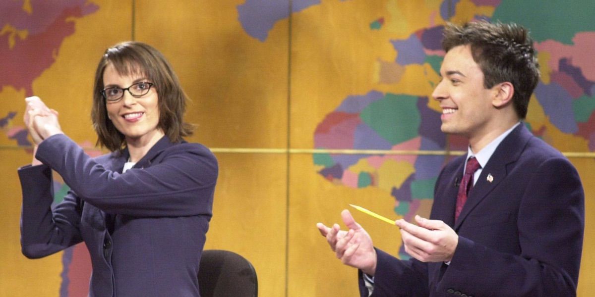Tina Fey accepts a round of applause with Jimmy Fallon on Weekend Update.