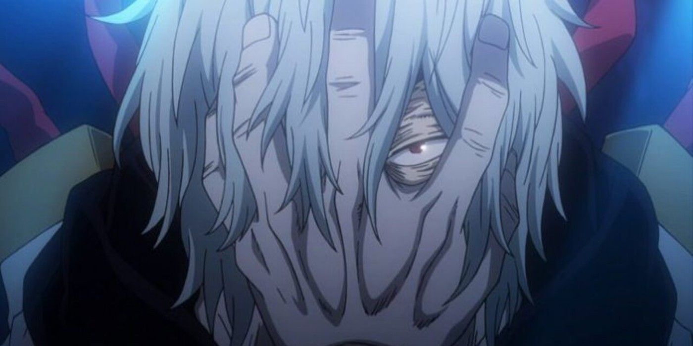 Tomura Shigaraki clutches his face with his hand