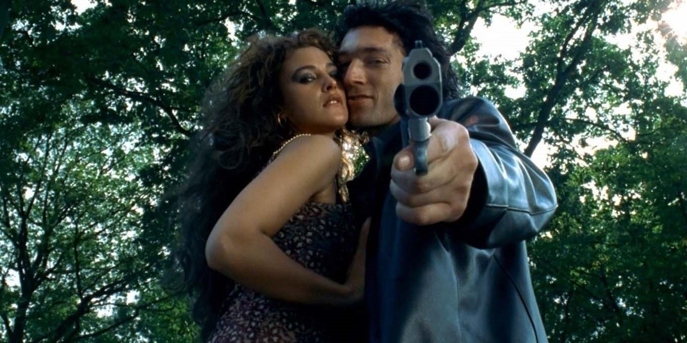 Vincent Cassel and Monica Bellucci with a gun in Dobermann
