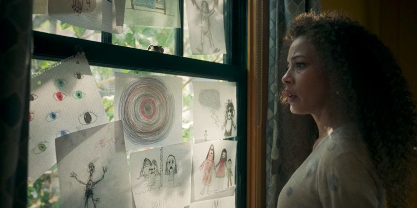 Taissa looks at Sammy's drawings on the window in Yellowjackets.