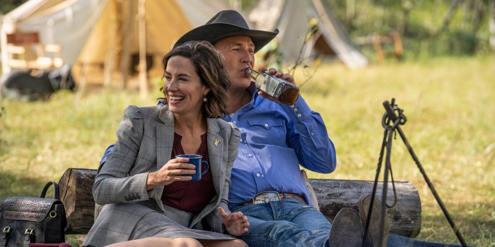 John and Governor Perry drink together at a picnic in Yellowstone