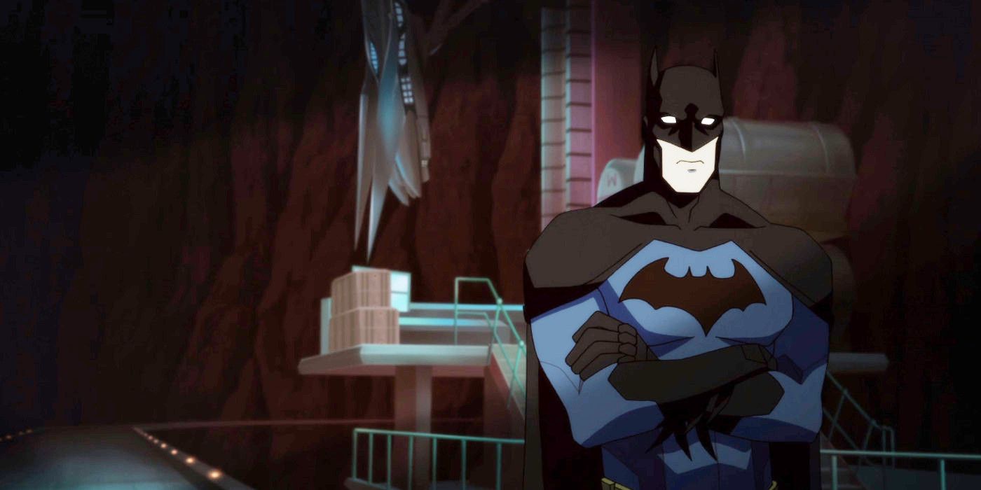 Batman with his arms crossed at the Batcave in Young Justice