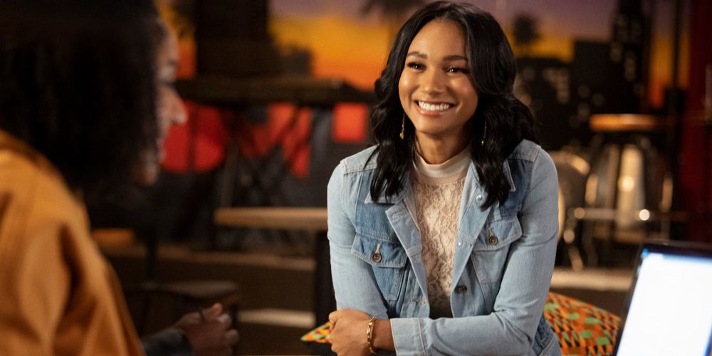 Layla wears a jean jacket and gold earrings on All American