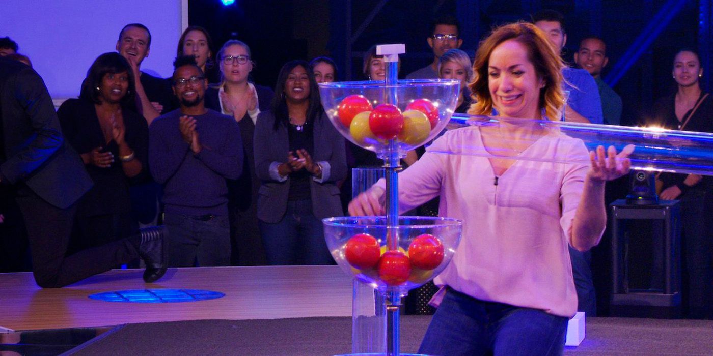 A woman works on a puzzle in the game show Awake: The Million Dollar Game.