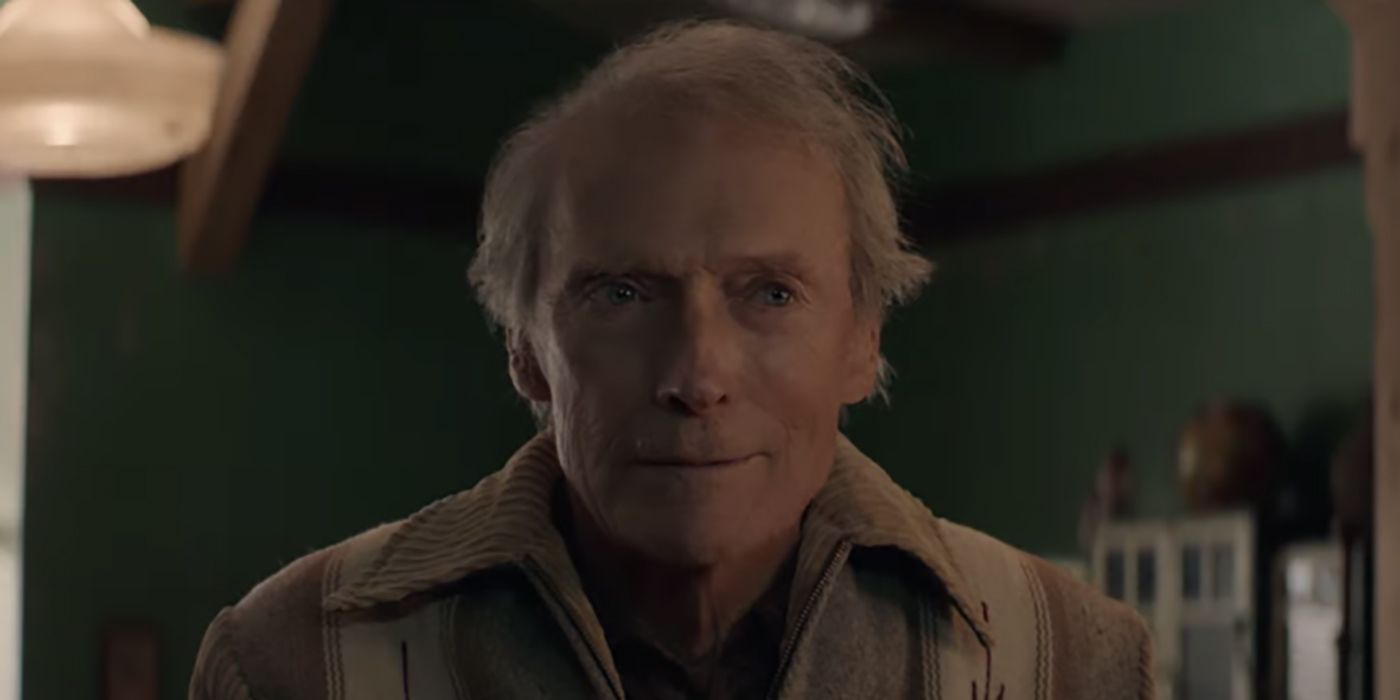 Clint Eastwood wearing a beige jacket and looking straight on with messy hair.