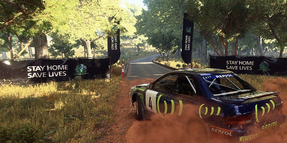 A black car drives on a dirt road in DiRT Rally 2.0