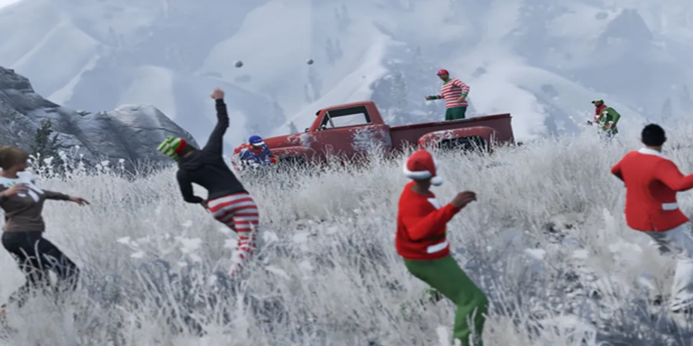 GTA Online players dressed in Christmas outfits having a snowball fight.