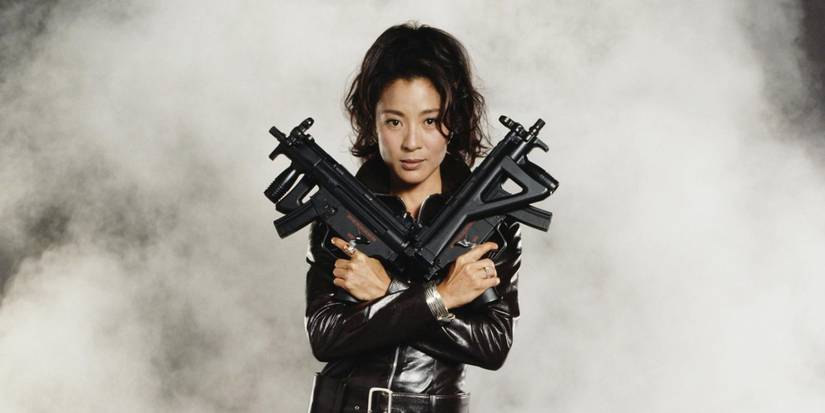 Michelle Yeoh as Wai Lin holding guns in Tomorrow Never Dies