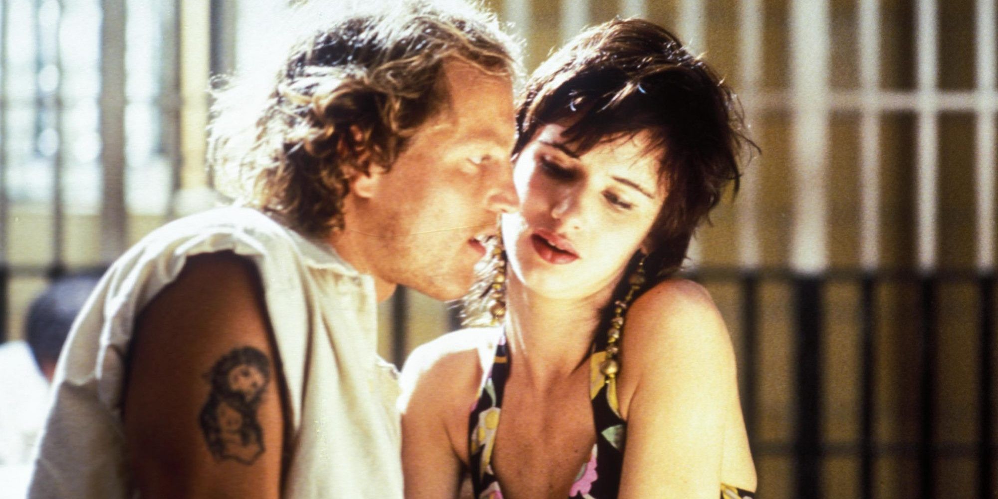 A woman talks to a man in jail in Natural Born Killers.