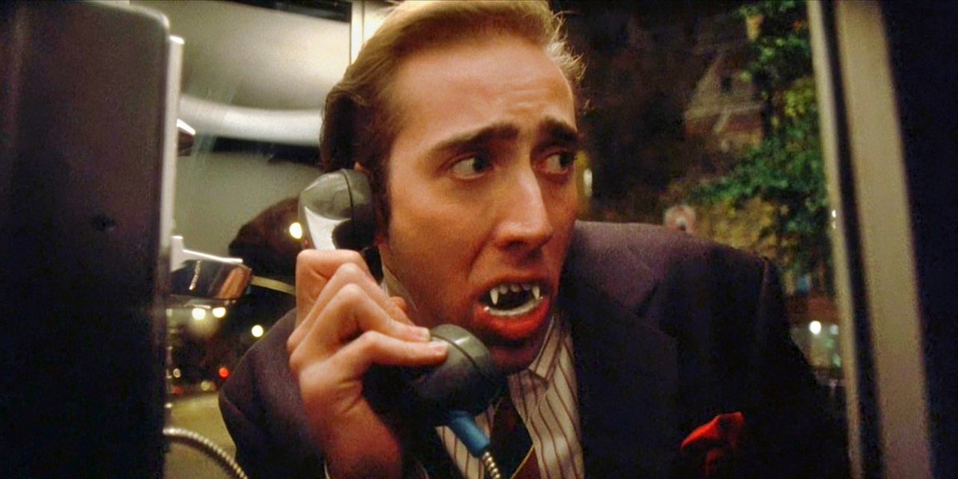 Nicolas Cage talking on the phone with fangs in Vampire's Kiss