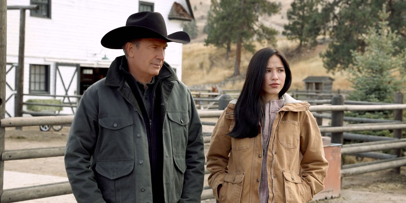 John (Kevin Costner) and Monica (Kelsey Asbille) standing together in Yellowstone