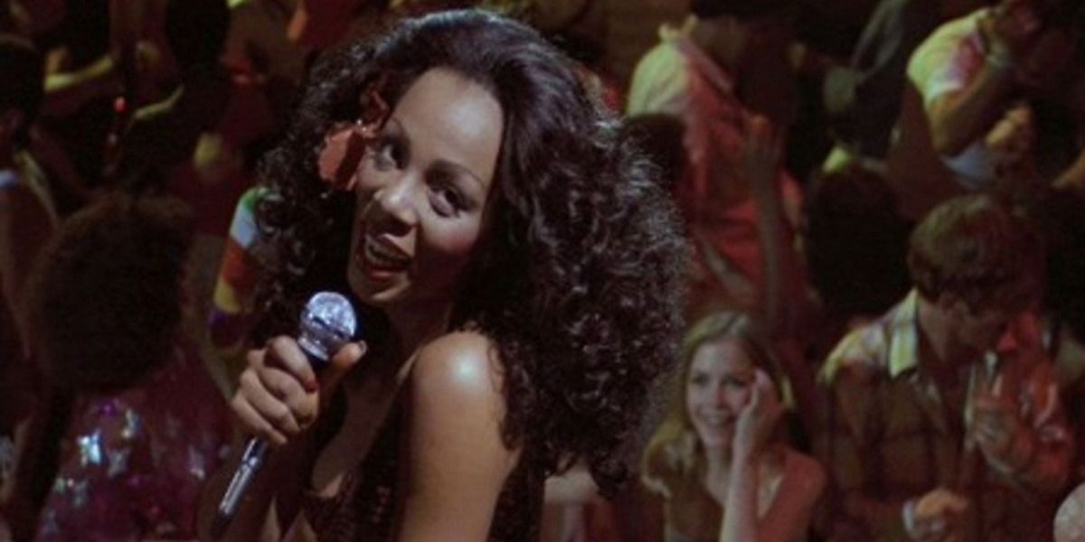 Donna Summer singing with crowd behind her in an image from thank God it;'s friday