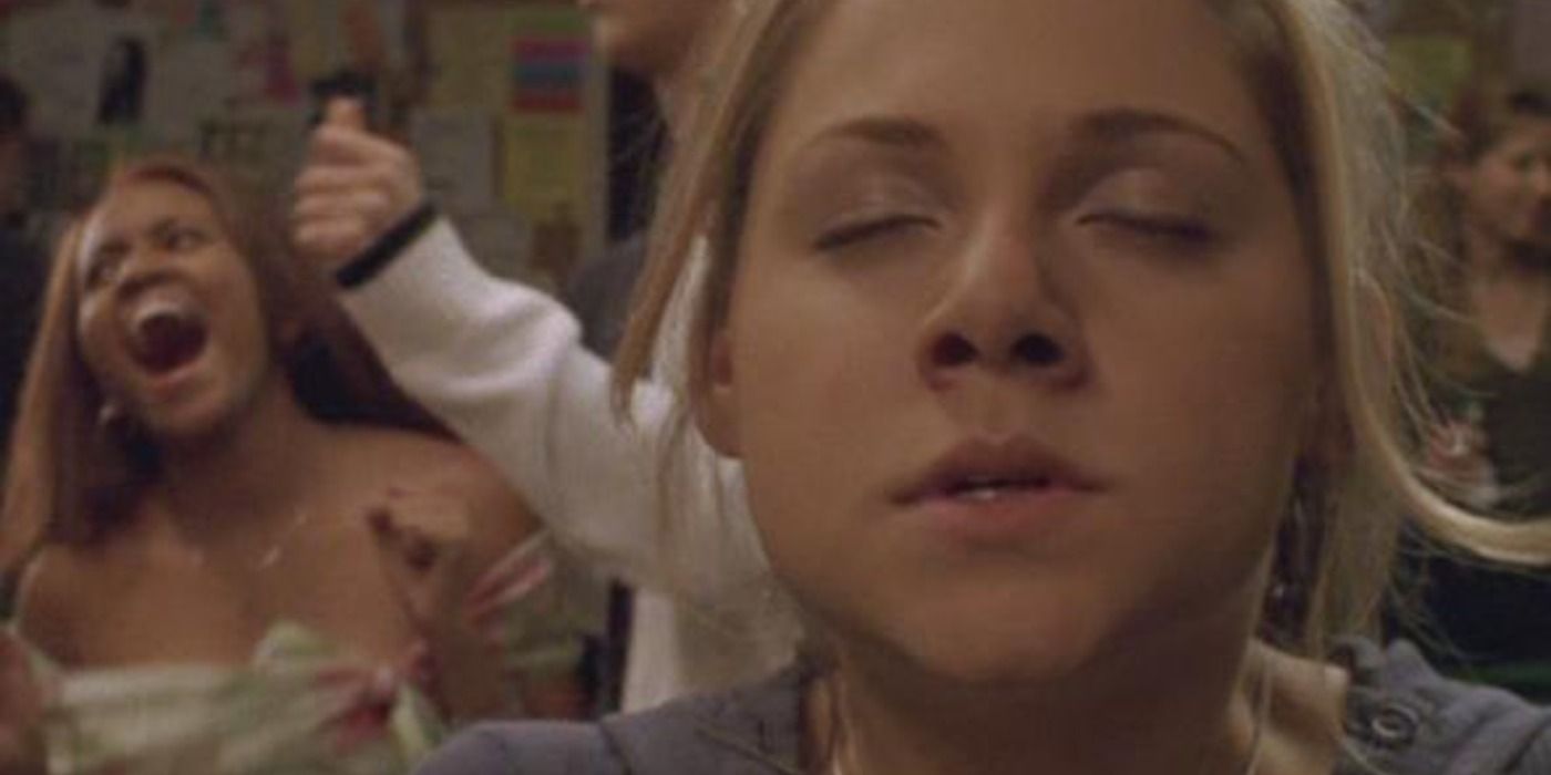 Paige with closed eyes at a party in Degrassi.