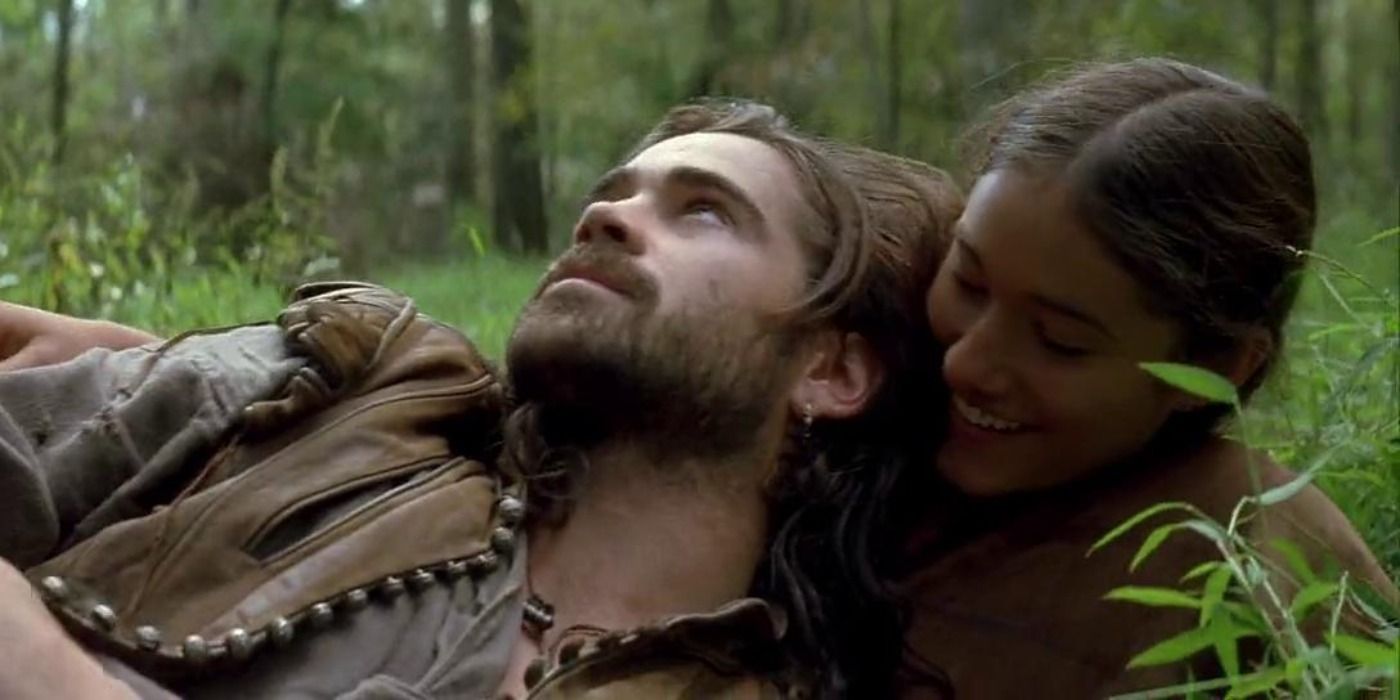 Captain John and Pocahontas lying on the ground in a forest in The New World.