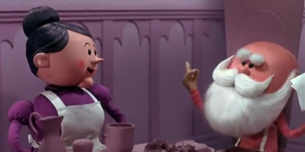 Mrs. Claus and Santa sit at the dinner table in Rudolph the Red Nosed Reindeer